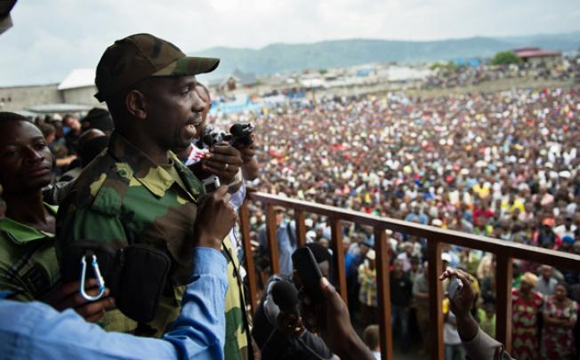 Spokesman of the M23 rebel group Lieutenant-Colonel Vianney Kazarama addresses a crowd at the Volcanoes Stadium in Goma on Wednesday. Photo: AFP