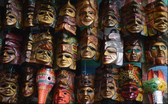 Wooden masks are offered to tourists at a handicrafts market in Chichicastenango municipality, Quiche department, 167 km west of Guatemala City, on November 15, 2012. Photo: AFP