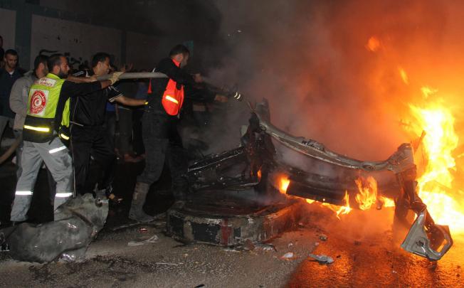 The wreck of the al-Aqsa TV car hit by Israel, killing two men.