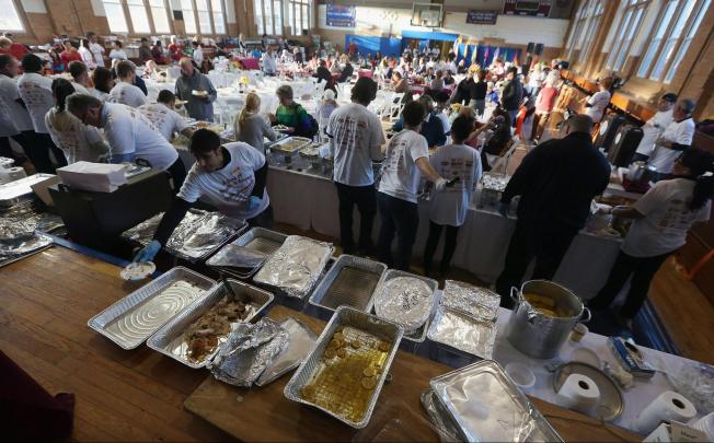 Free Thanksgiving dinners at a parish in Rockaway. Photo: AFP