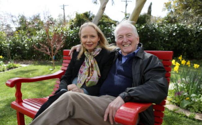 Australian best-selling author Bryce Courtenay poses with wife Christine Gee on a park bench in Canberra Australia Courtenay. Photo: AP