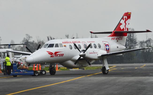 An air ambulance transporting the four Chinese oil workers \released from their Farc captors lands at the airport in Bogota.  Photo: AFP