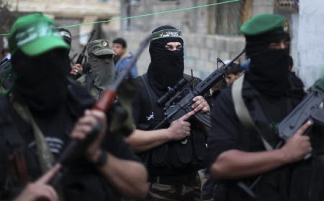 Masked and armed members of Hamas in Gaza. Photo: EPA