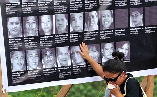 A relative of one of the 58 victims slain in the 2009 massacre grieves at a memorial service in Ampatuan, Maguindanao province. Photo: AFP 