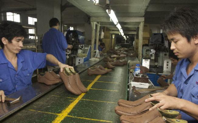 Workers work in the factory of China Huite Shoes Company in Wenzhou. Photo: Ricky Wong