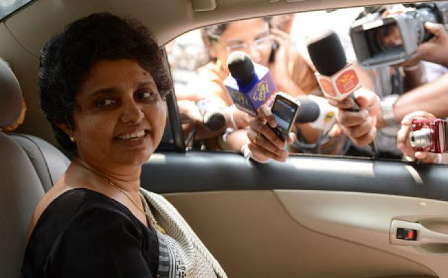 Sri Lanka’s Chief Justice Shirani Bandaranayake smiles as she leaves the parliamentary complex in Colombo on November 23, 2012. Photo: AFP