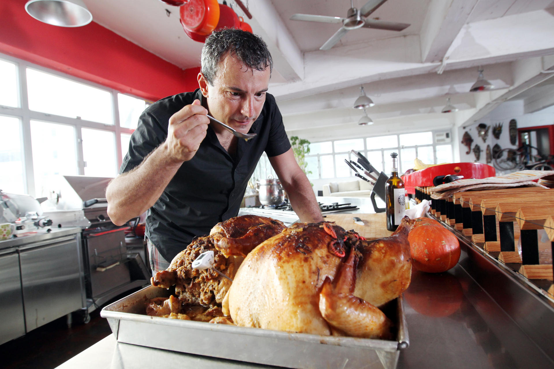 Andrea Oschetti with Thanksgiving birds. Altering the cooking method can make turkey healthier. Photos: Dickson Lee