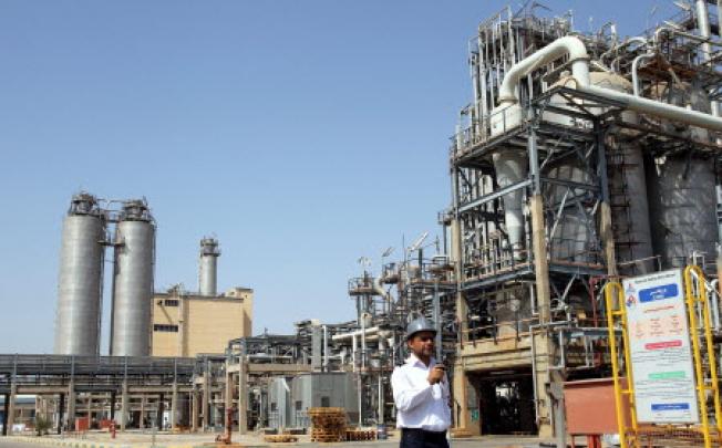 An Iranian security guard walking in front of the Mahshahr petrochemical complex in Khuzestan province south western Iran on September 28, 2011. Photo: EPA