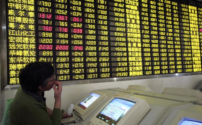 Foreign institutional investors on the mainland can only invest in stocks and bonds under the QFII scheme, which may soon be expanded. Photo: AP 