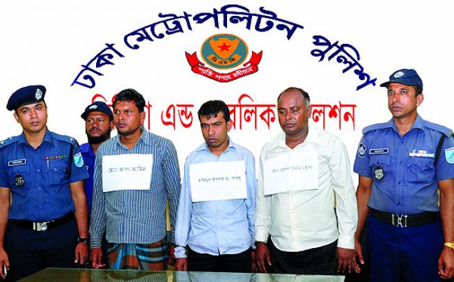 The Dhaka Metropolitan Police parade managers from the Tazreen garment factory arrested in Dhaka. Photo: AFP