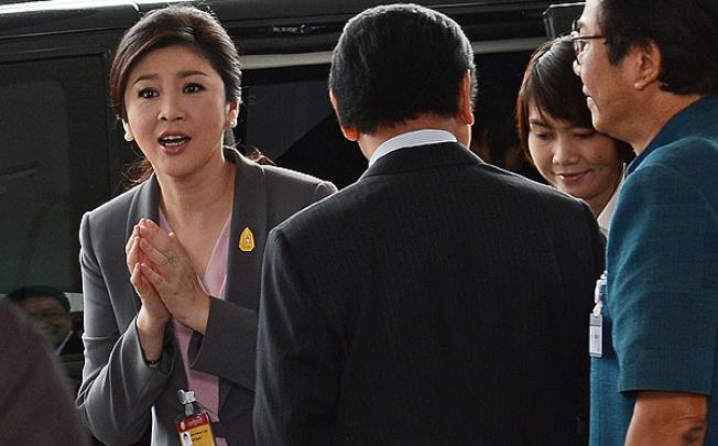 Thai Prime Minister Yingluck Shinawatra arrives at the Thai parliament in Bangkok on Wednesday. Photo: AFP