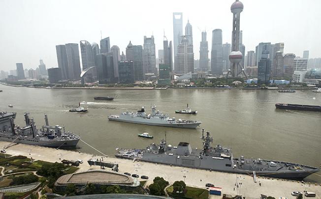 Indian naval vessels dock at the Bund in Shanghai. Photo: AP