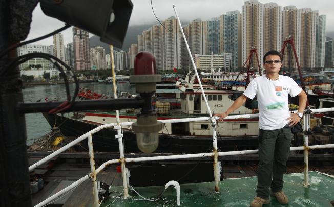 Liu Peiwen, seen here on the  Kai Fung No 2 in Aberdeen harbour, walked 3,000km from Wuhan to Hong Kong to arouse national awareness for the Diaoyu Islands. Photo: Sam Tsang