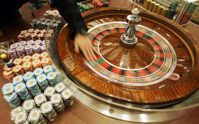 SJM leads casinos' slide on junket curb worries