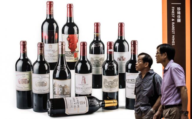 A billboard displays premium wine lots at Sotheby's autumn sales in Hong Kong in October. Photo: SCMP