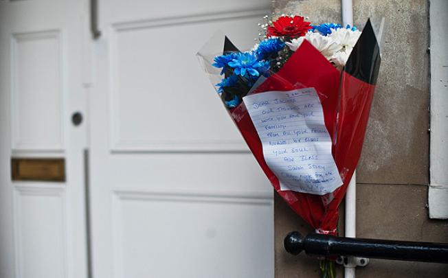 A bunch of flowers is left outside the nurses accommodation block by colleagues near the King Edward VII hospital in central London on Saturday in memory of nurse Jacintha Saldanha who was found dead the previous day. Photo: AFP