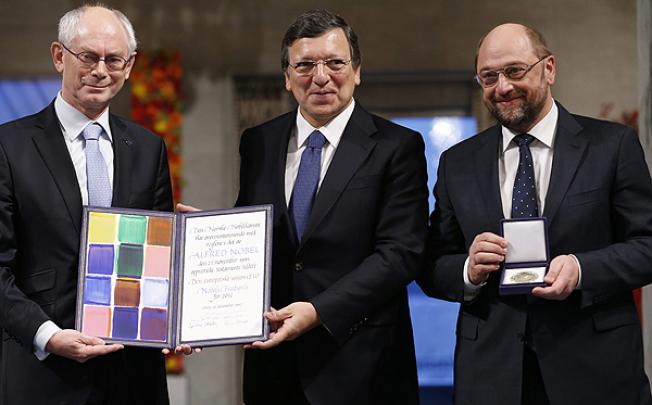 (Left to right) European Council President Herman Van Rompuy, European Commission President Jose Manuel Barroso, and European Parliament President Martin Schulz hold the Nobel diploma on the podium in Oslo City Hall. Photo EPA