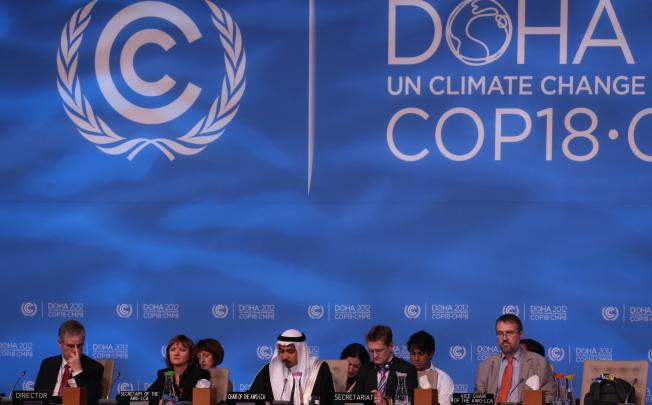 Delegates attend the UN climate talks in Doha. Photo: AFP