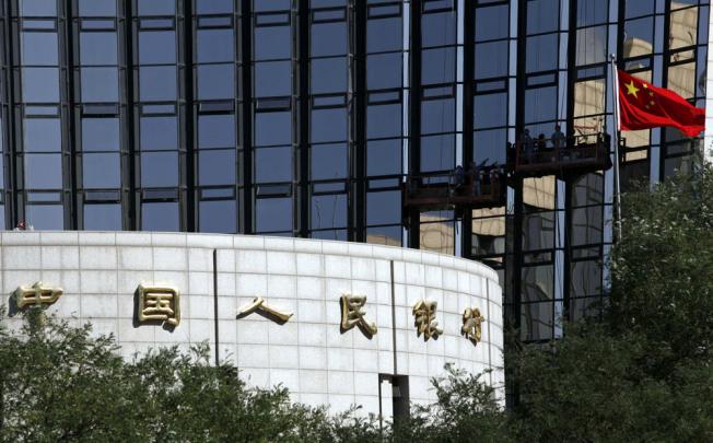 People's Bank of China, mainland's central bank, is forecasted to ease its monetary policy next year. Photo: Reuters