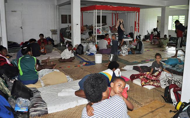 Residents take shelter at an evacuation centre in Suva. Photo: AFP