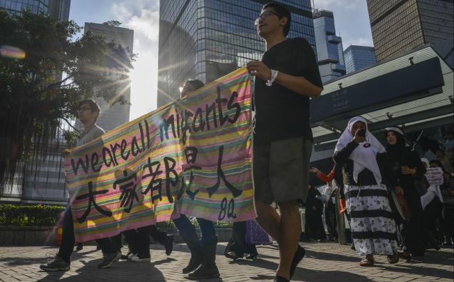 About a thousand migrant domestic workers from Southeast Asia rallied in Hong Kong to mark International Migrants Day and push for better working conditions and higher wages. Photo: AFP