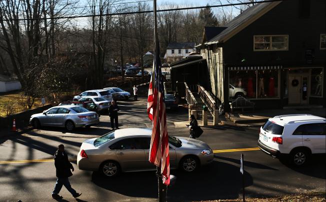 Connecticut community copes with aftermath of the mass shooting. Photo: AFP