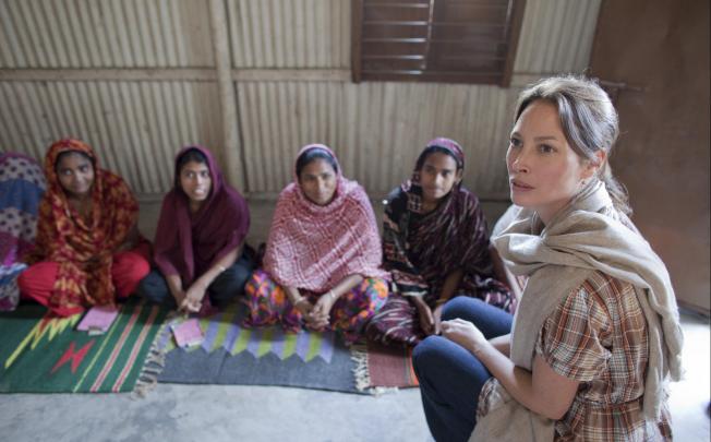 Every Mother Counts founder, Christy Turlington Burns (far right), visits village women in Bangladesh. Photo: CARE