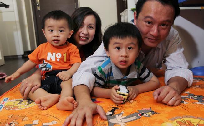 Father Ivan Wong Chin (right) was able to enjoy paternity leave thanks to new company policy. Photo: Edmond So