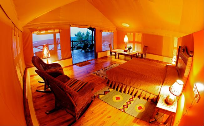 The warm interior of Mweya Safari Lodge in Uganda looks out onto spectacular views.