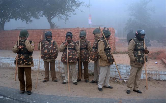 Indian police outside a cremation ground in New Delhi, ahead of a cremation ceremony for the gang-rape victim. Photo: AFP