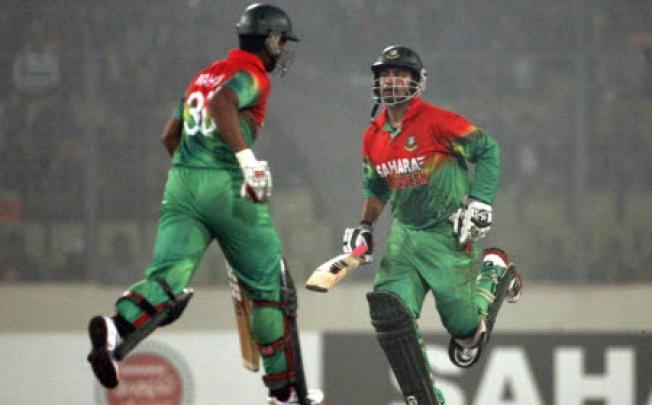 Bangladesh's Tamim Iqbal (right) and Mahmudullah during a match against the West Indies in December last year. Bangladesh said it has shelved a planned cricket tour of Pakistan. Photo: AP