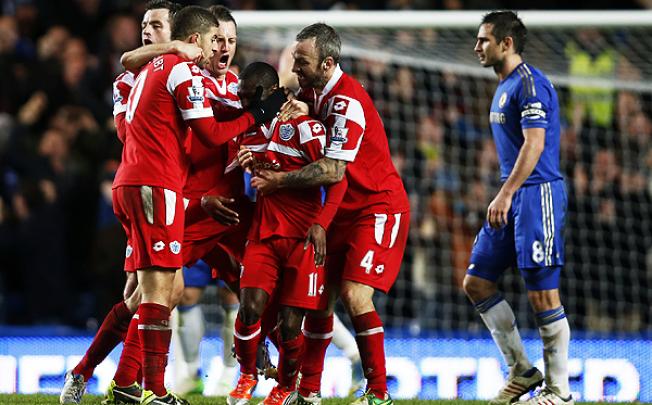 Shaun Wright-Phillips is mobbed by his teammates after scoring against Chelsea. Photo: Xinhua