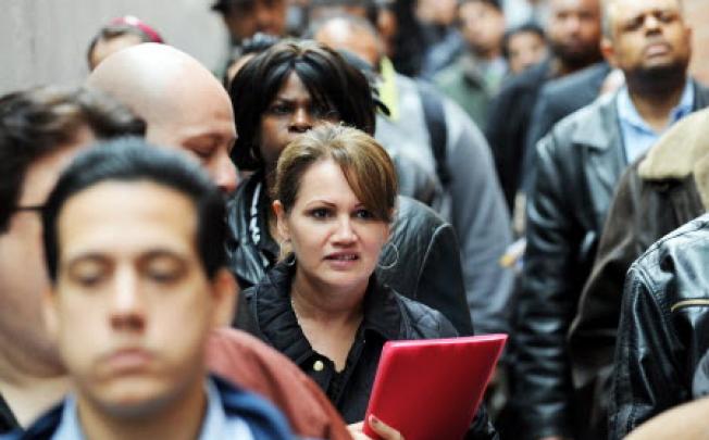 People seeking jobs  at an employment fair in New York. Photo: AFP