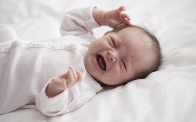 Infants who wake up crying in the middle of the night are best left to self-soothe and fall back to sleep on their own. Photo: Corbis