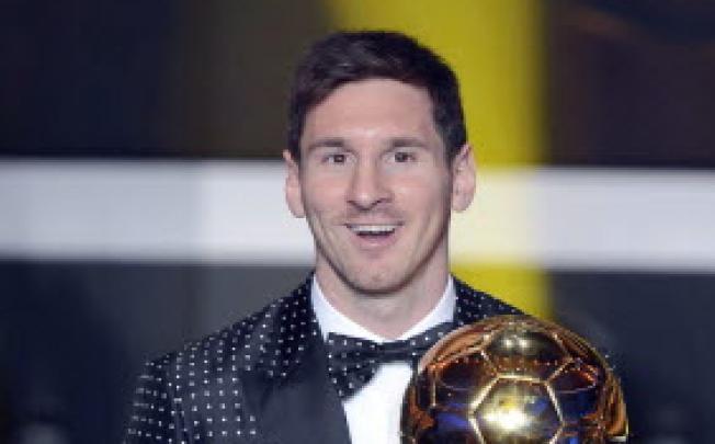 Argentina's Lionel Messi poses with the trophy after winning the FIFA Men's World Player of the Year Award. Photo: AP