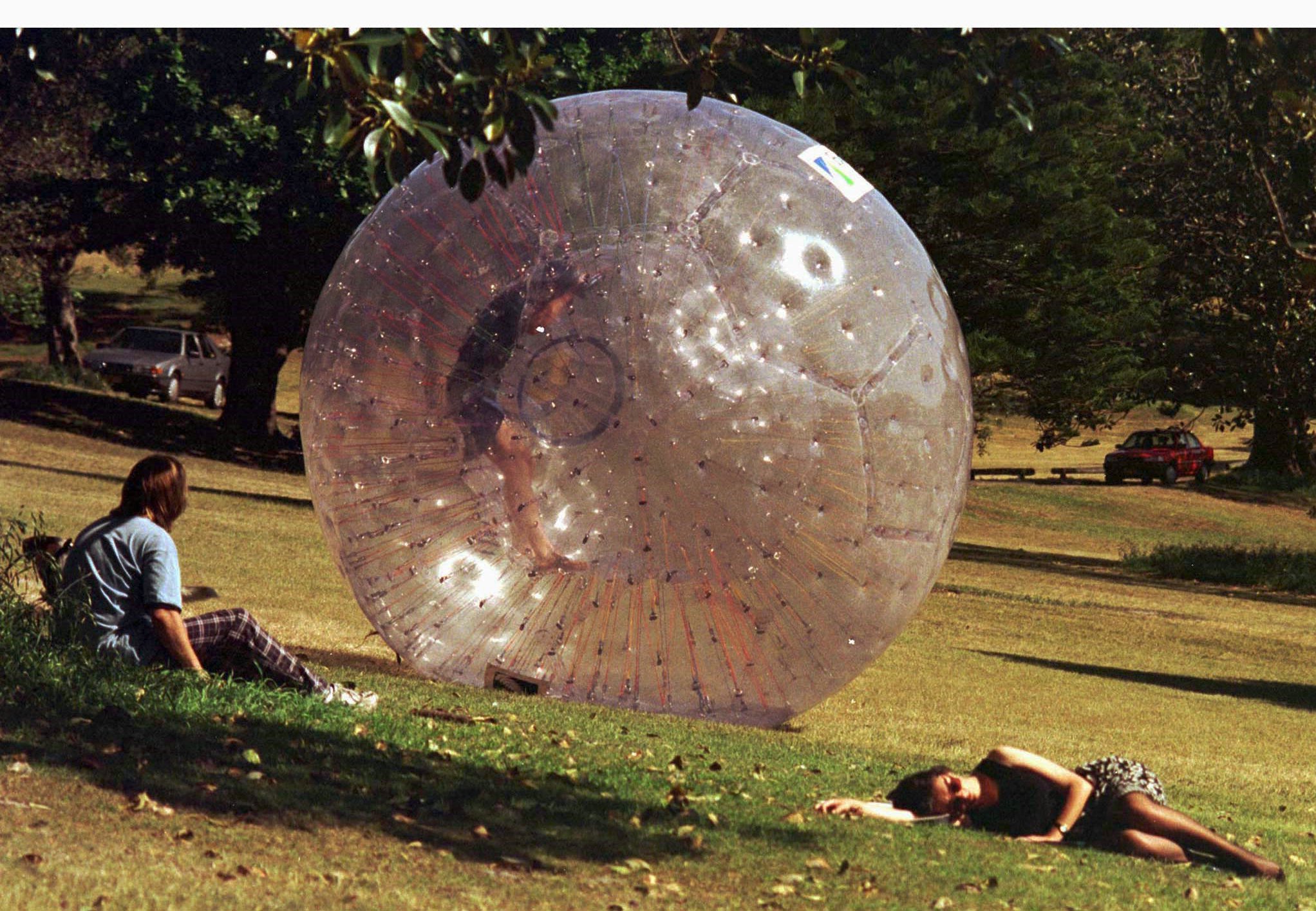 Inventor David Akers rolls inside a ‘Zorb’, down a Sydney hill. Zorbs can reach speeds of up to 50 kilometres per hour, but a tragedy in Russia this week has highlighted the risks involved in the sport. Photo: Reuters