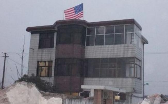 A US flag flying from the top floor of a village home in Taizhou city, Jiangsu. Picture: SCMP Photos and Weibo.