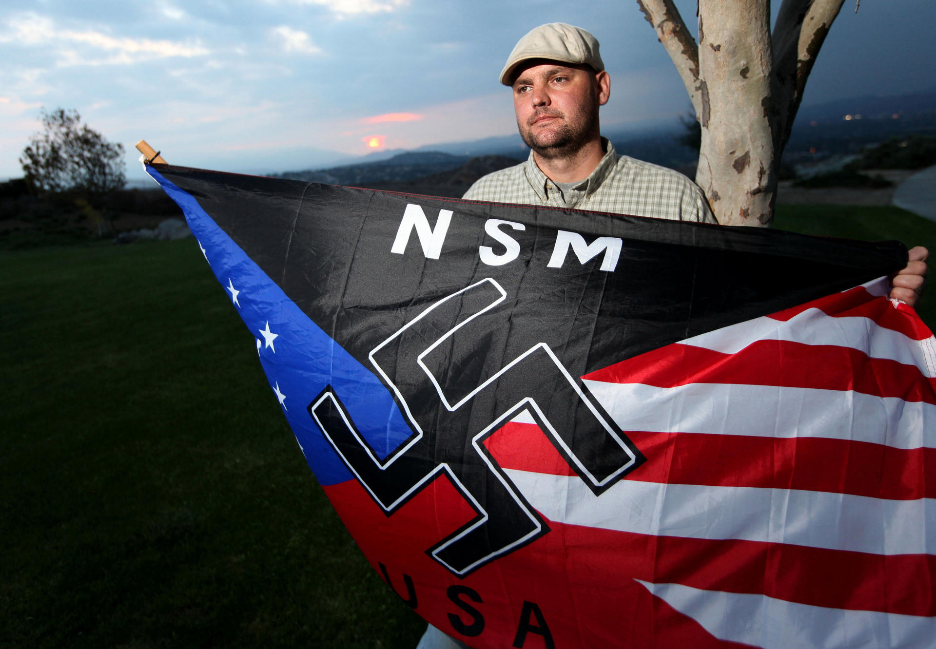 Extremist Jeffrey Hall with a neo-Nazi flag in 2010. Photo: AP