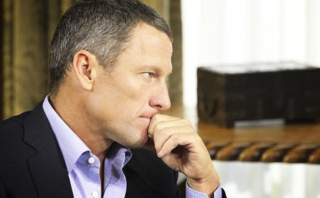 Lance Armstrong speaking with Oprah Winfrey in Austin. Photo: Reuters