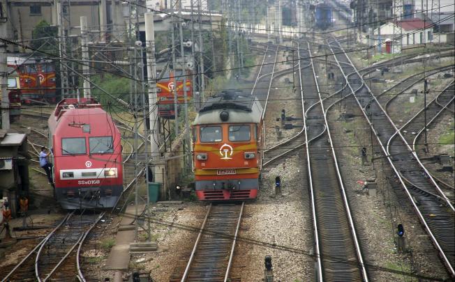 Trains run on the Nanjing-Shanghai railway route in Nanjing, China. Photo: AP