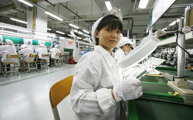 A worker at Foxconn's Longhua factory in Shenzhen. Photo: Reuters