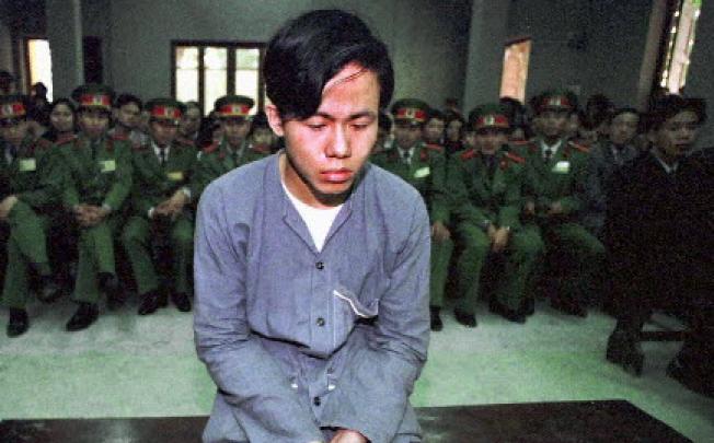 A young Vietnamese hears that he will be executed by firing squad in Hanoi in 1997. Photo: Reuters