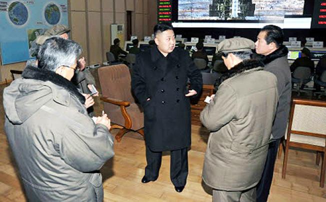 North Korean leader Kim Jong-un (centre) visits a satellite launch site in Cholsan county. North Korea is threatening “physical counter-measures” over tighter UN sanctions following its recent rocket launch. Photo: Reuters