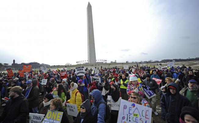 Protesters hold up placards during the March on Washington for Gun Control on Saturday. Photo: Xinhua