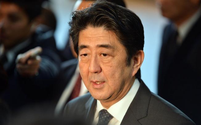 Japanese Prime Minister Shinzo Abe is pushing for aggressive action to weaken the yen. Photo: AFP
