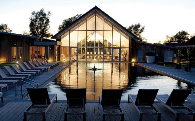 One of the two heated pools at the Lower Mill Estate in the Cotswolds, with the indoor spa and eco pool at the back. Photo: SCMP