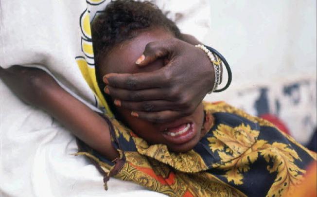 A six-year-old girl screams in pain while undergoing circumcision in Hargeisa in Somalia. Photo: AP
