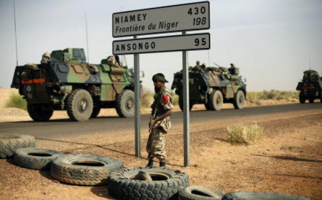 French armoured vehicles are seen heading towards the Niger border before making a left turn north in Gao, northern Mali. Photo: AP