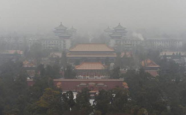 Heavy smog hangs over Beijing last month. Photo: AFP