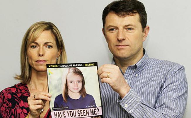 Kate and Gerry McCann pose with a missing poster, an age progression computer generated image of their daughter, Madeleine. Photo: AP